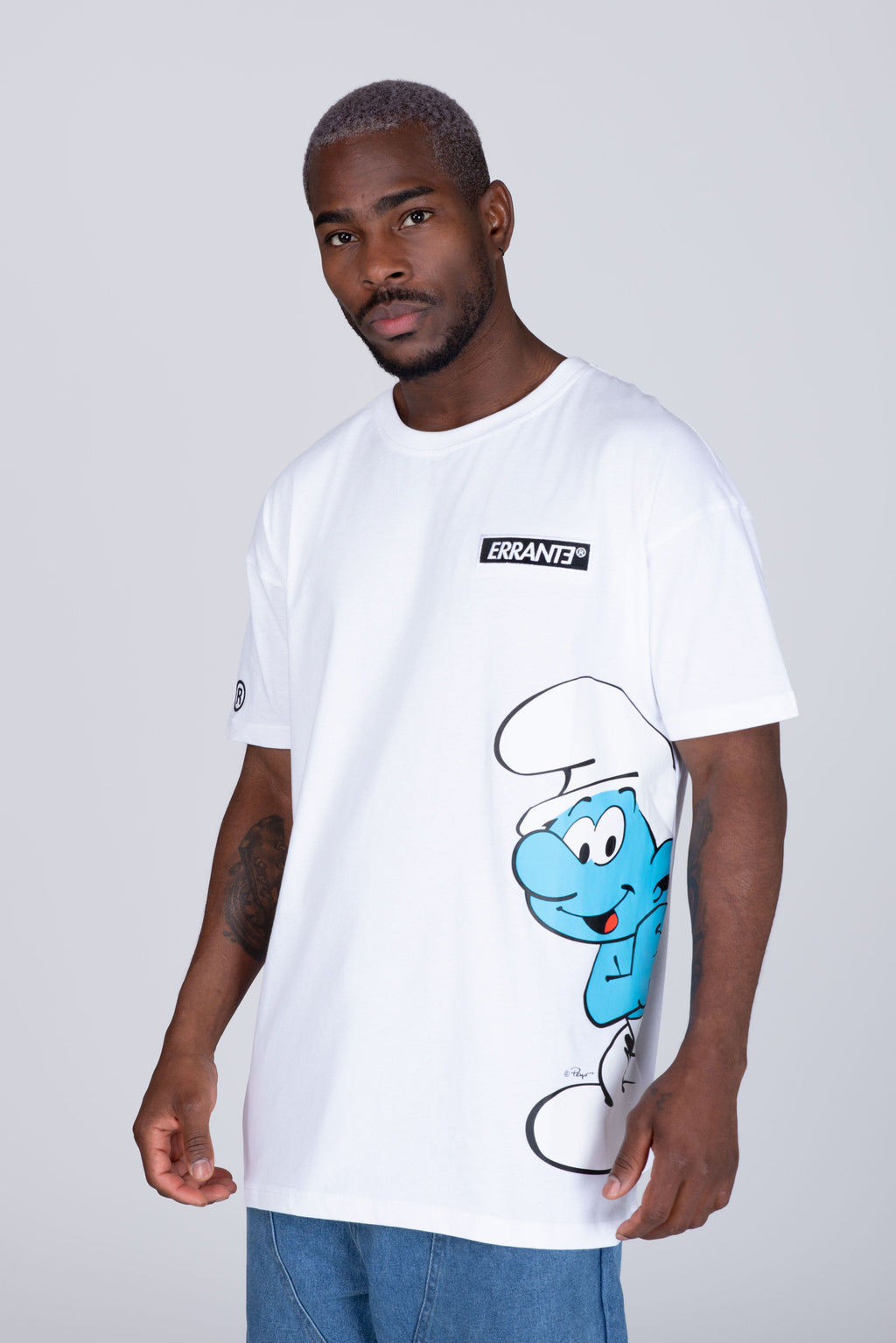 Polera Manga Corta Pitufos Peeking Blanco ERRANTE