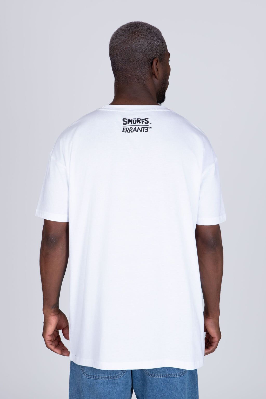 Polera Manga Corta Pitufos Peeking Blanco ERRANTE