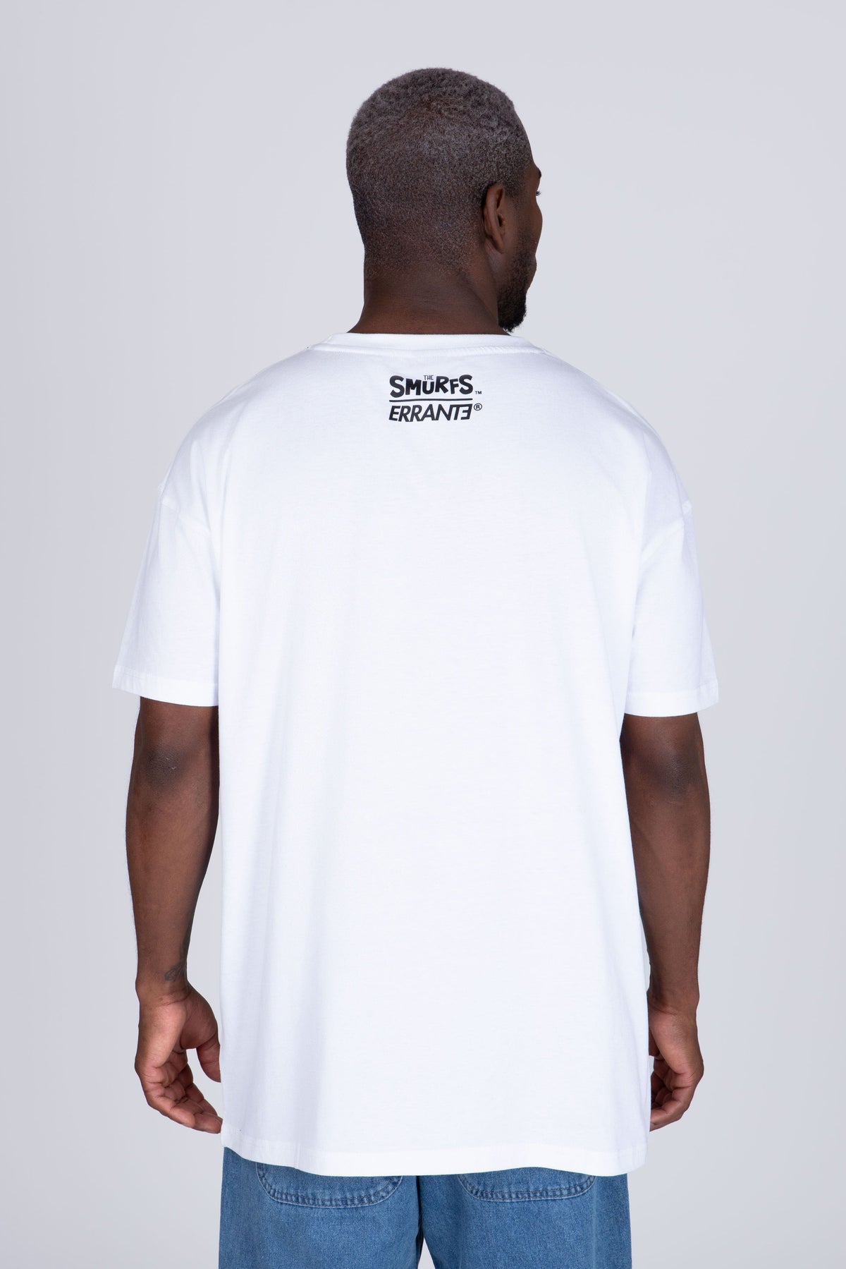 Polera Manga Corta Pitufos Peeking Blanco ERRANTE