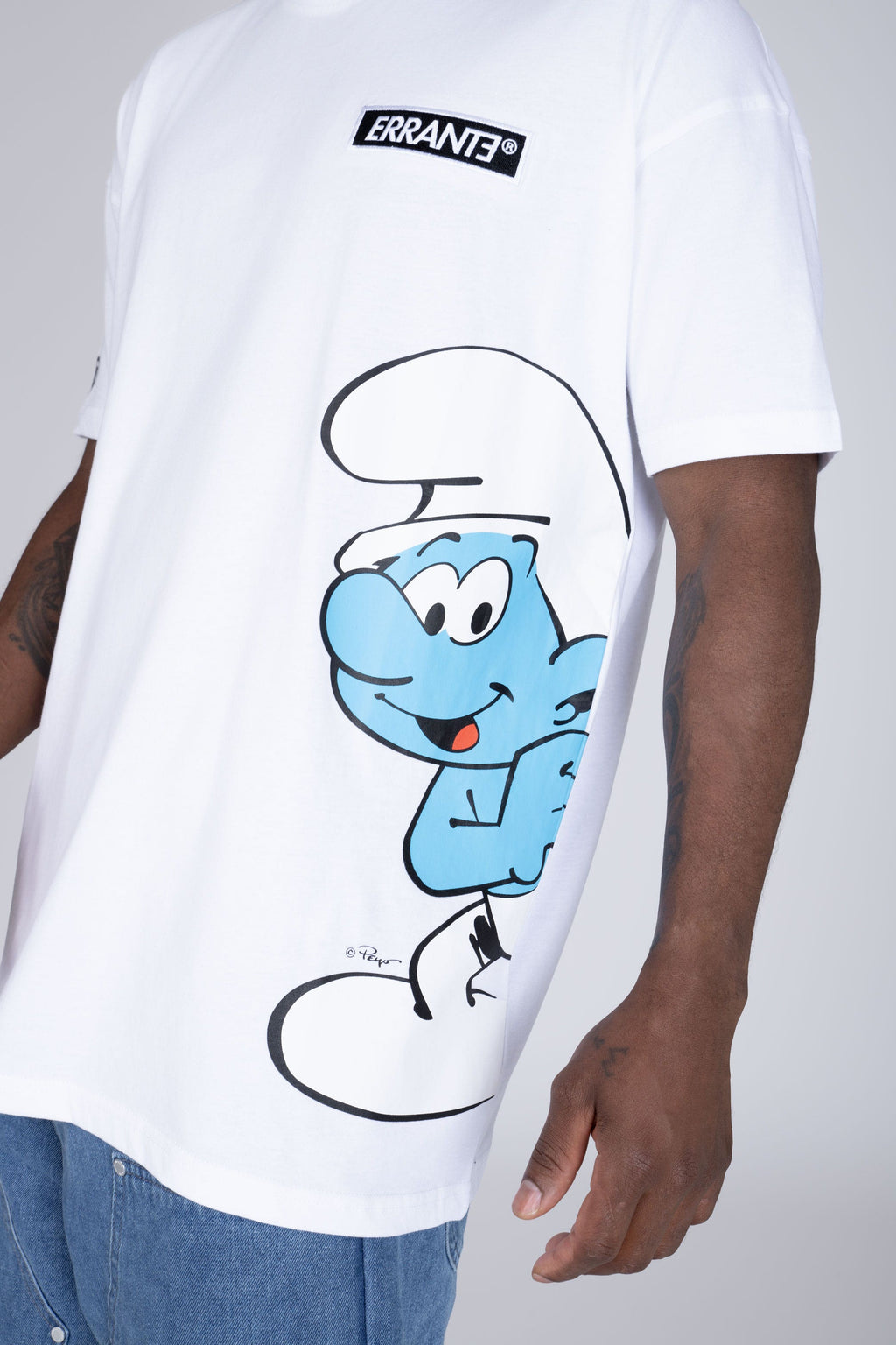 Polera Manga Corta Pitufos Peeking Blanco ERRANTE