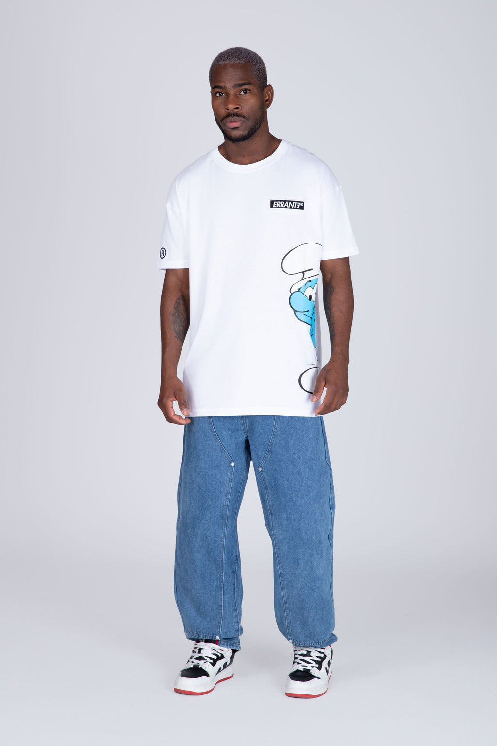 Polera Manga Corta Pitufos Peeking Blanco ERRANTE